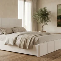 تخت خواب ورونیا با طراحی شیک و رنگ سفید، در اتاق خوابی با کفپوش چوبی، تابلو نقاشی دیواری و روتختی کرم و طوسی